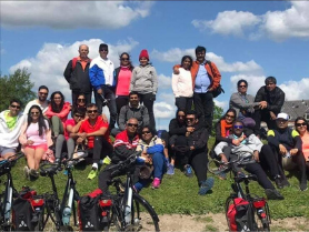 Group photo after a couples coaching in Europe cycling challenge on a sunny hillside