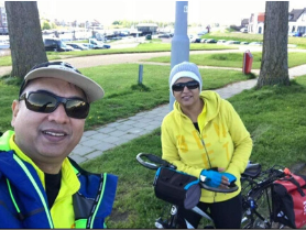 Cycling warm-up for couples coaching in Europe, two riders smiling before the ride