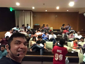 Manish Gupta selfie with couples coaching participants relaxing between breakout modules