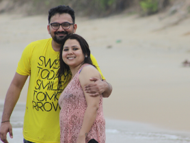 Joyful beach pose after sunrise mindfulness, closing couples coaching in Goa week