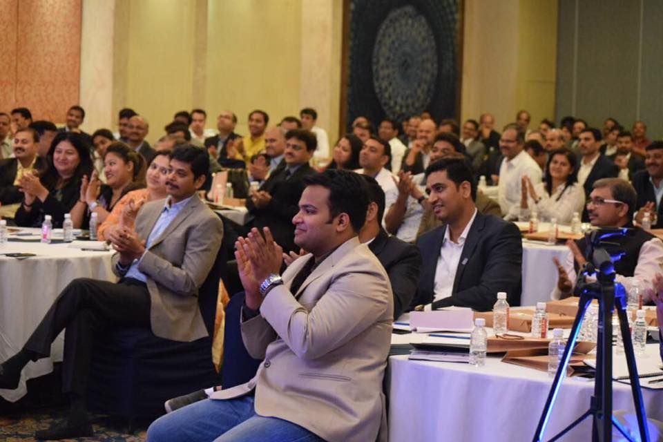 Conference audience applauding a workshop on consulting business ideas delivered by consulting companies in Pune.