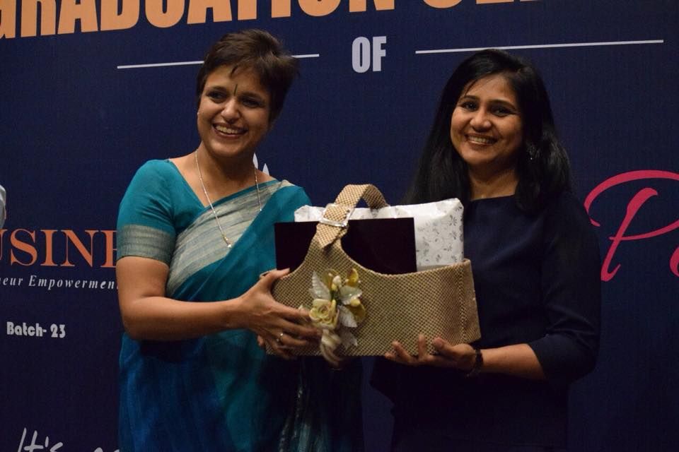 Gift-exchange ceremony celebrating collaboration between programme alumni and business development consultant mentors.