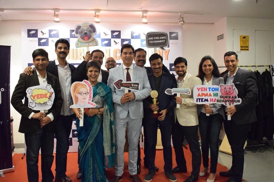 Graduating cohort posing with playful props after completing the entrepreneurship development programme.