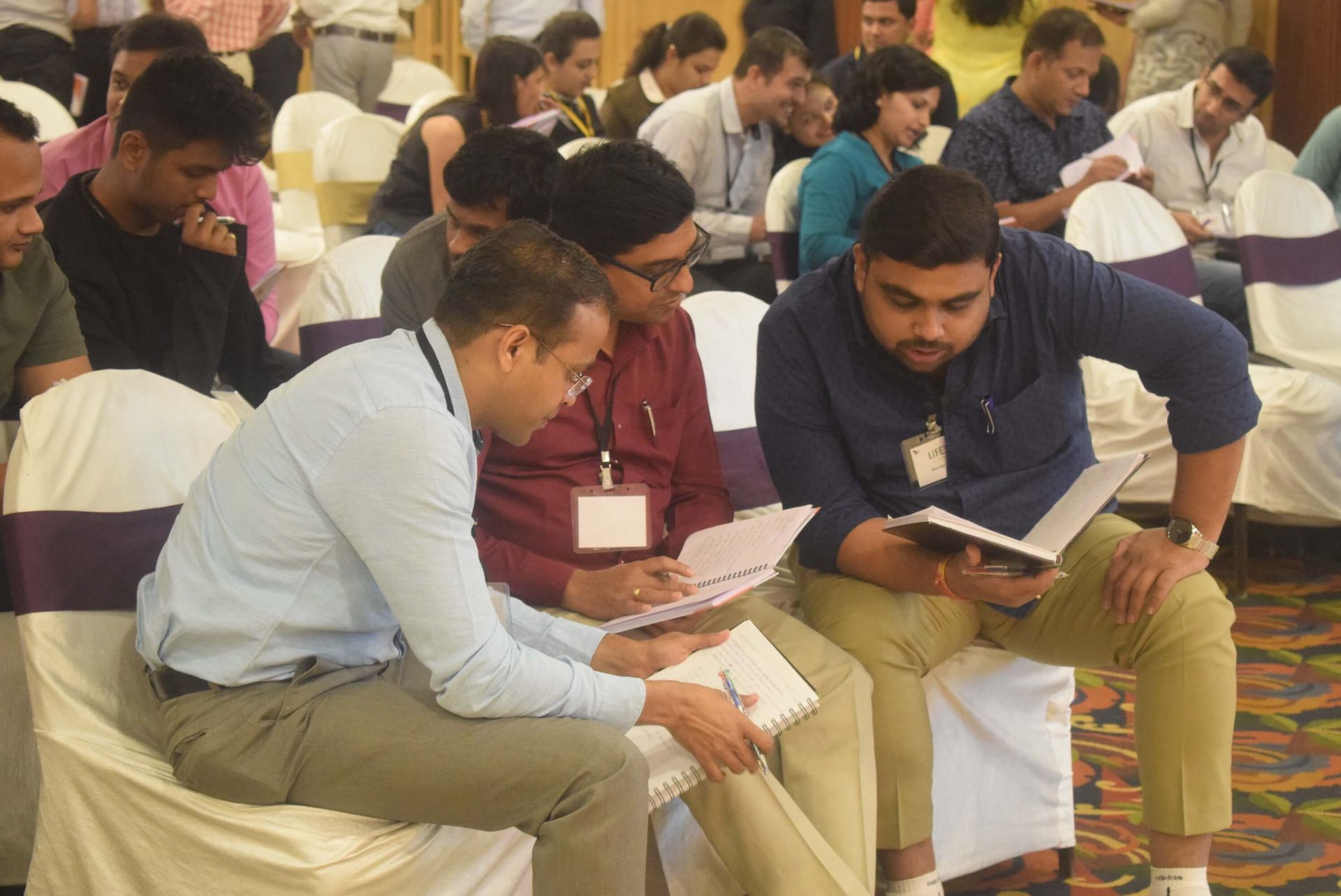 Life 360 participants practicing energy-sustaining movements with their life coach in Pune