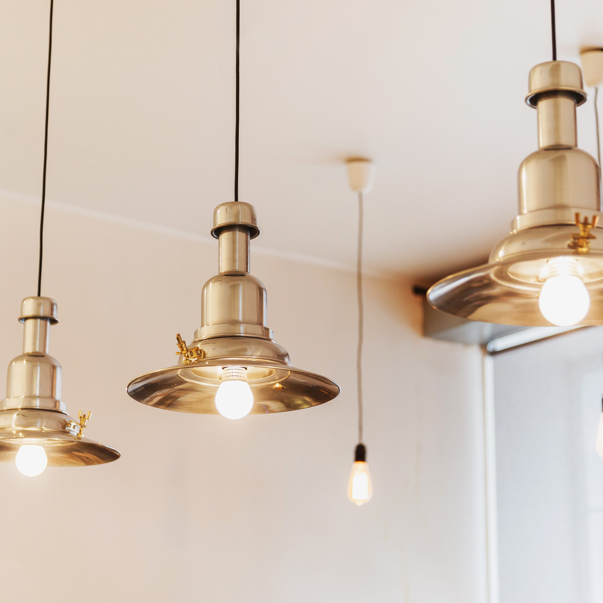 Michael Lawrence Electric Inc
- Three pendant lights are hanging from the ceiling in a room