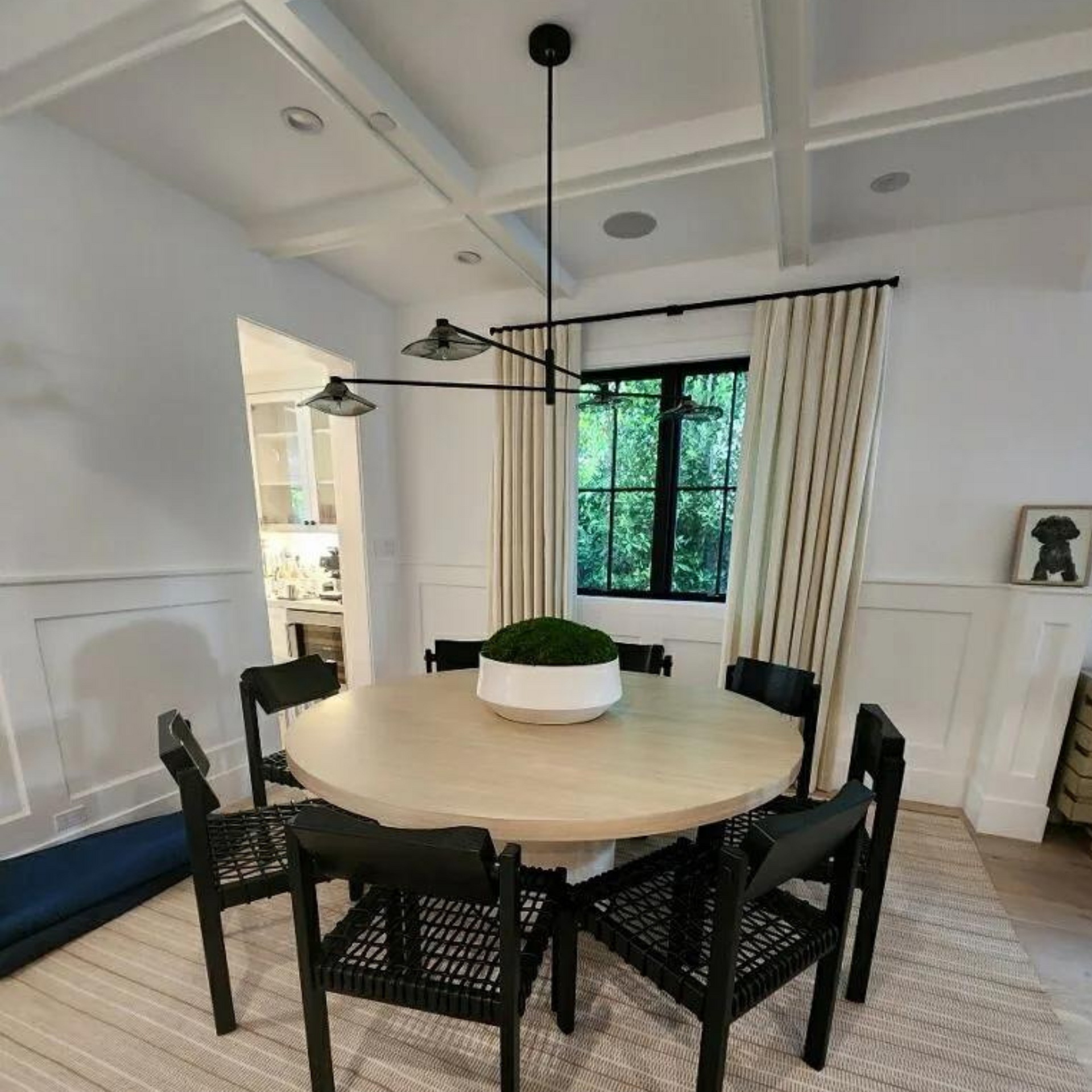 Michael Lawrence Electric Inc
- A dining room with a round table and chairs