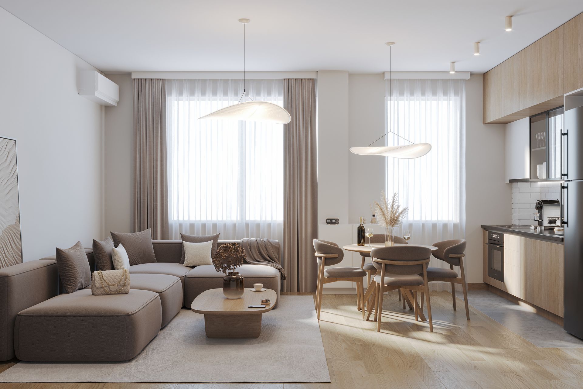 A living room with a couch , table and chairs and a kitchen.