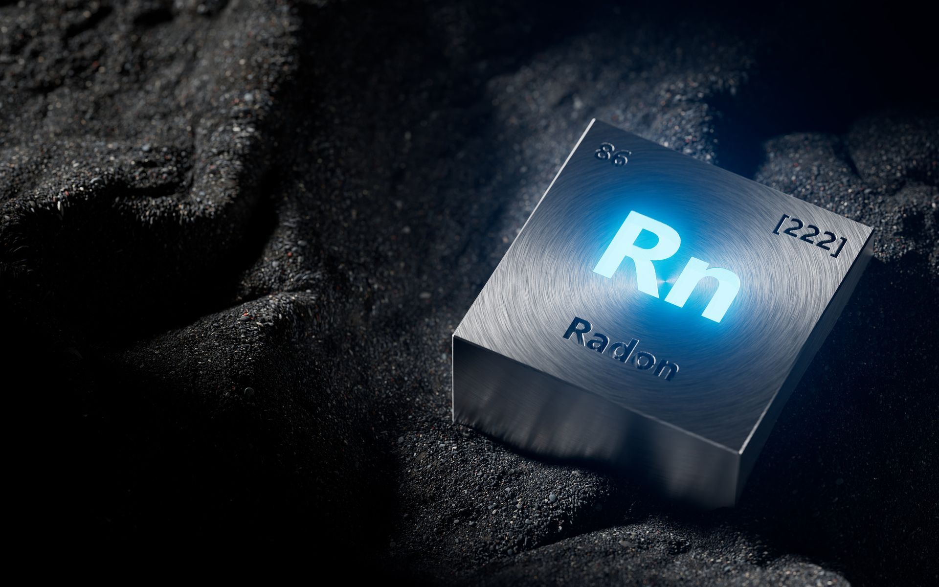 Radon element cube with atomic number 86 and mass 222 on dark surface.