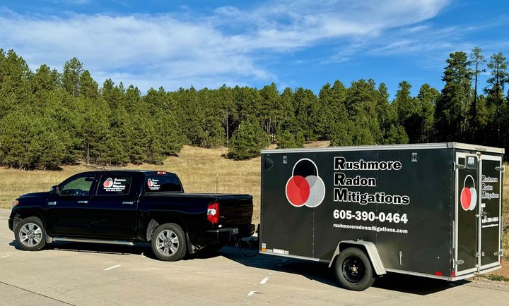 A truck is pulling a trailer.