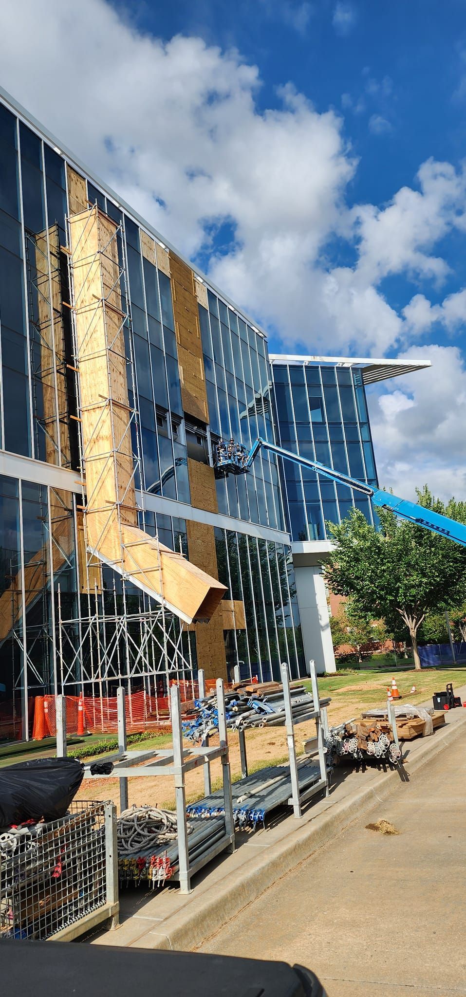 A large building with a lot of windows is being built.
