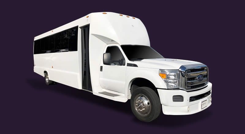 A white bus is parked on a purple background.