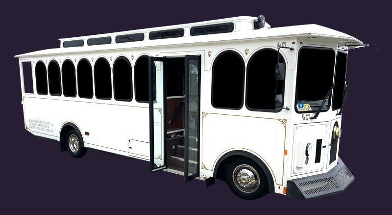 A white trolley bus with the doors open on a purple background.