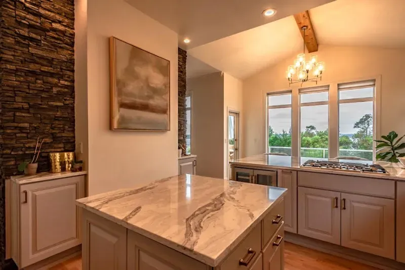 There is a large island in the middle of the kitchen.