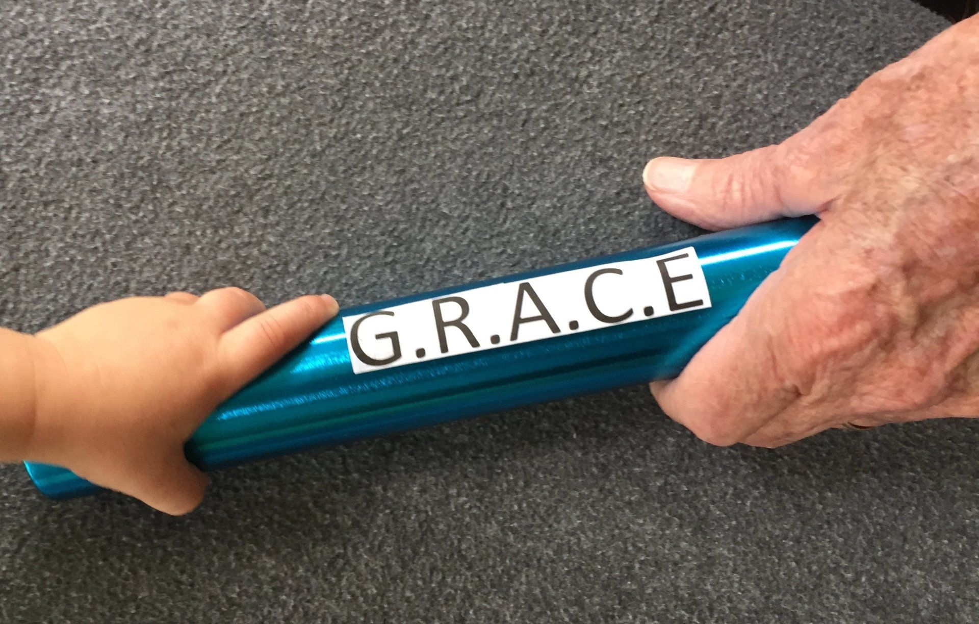 Blue pipe with printed GRACE acronym