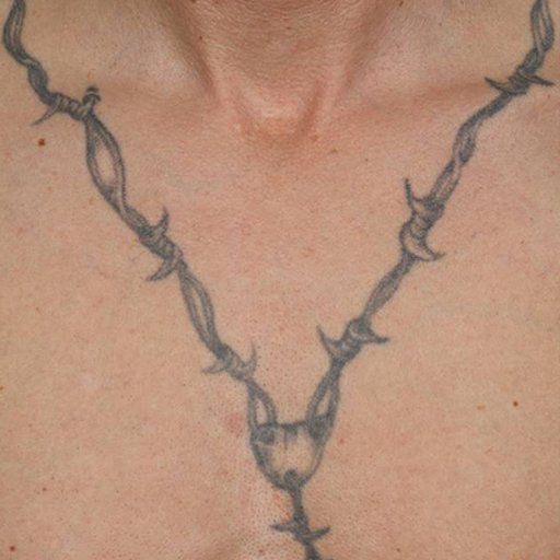 A man has a barbed wire tattoo on his chest.
