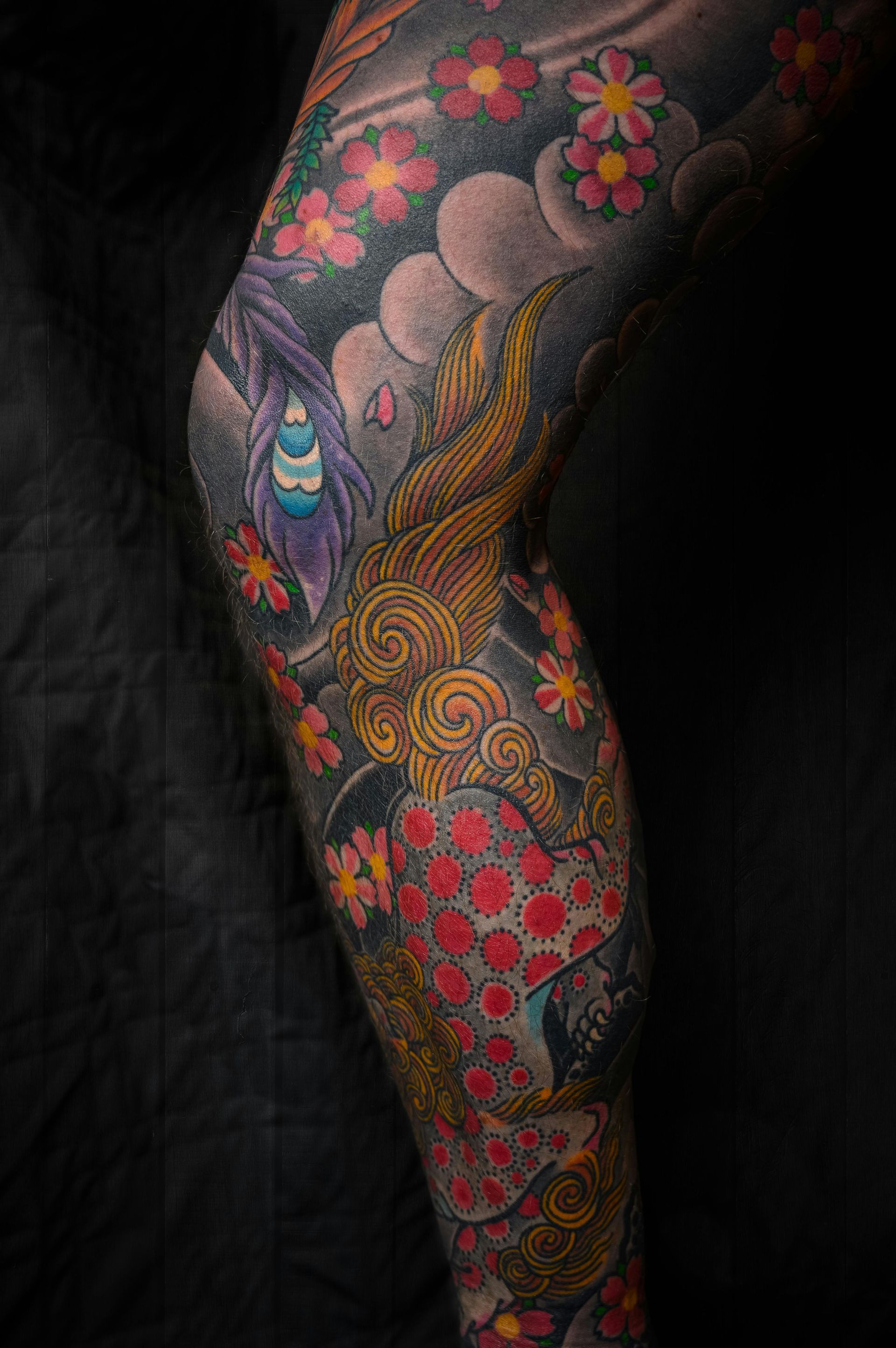 A close up of a person 's leg with a tattoo on it.