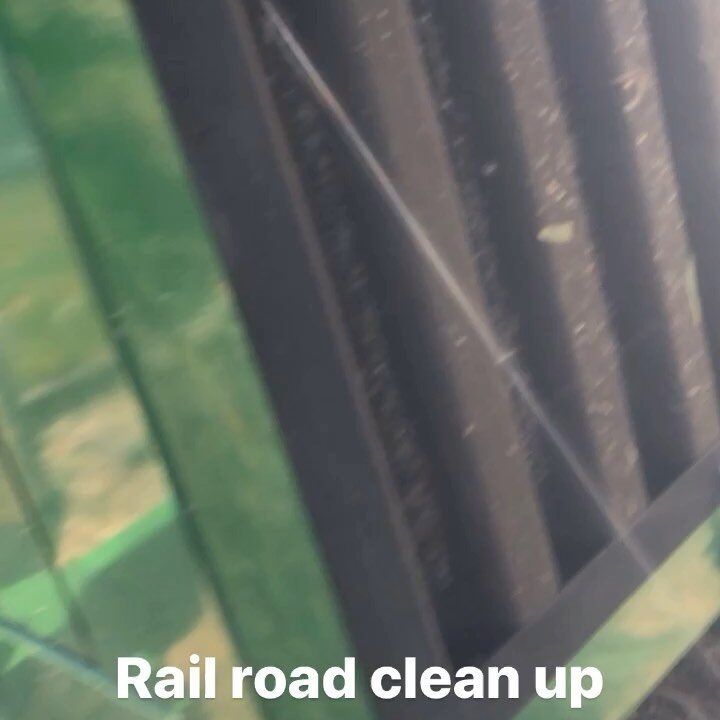 Railroad clean up. Green, black and silver rails and components up close.