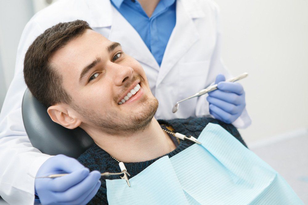 Man Smiling During Dental Check-up