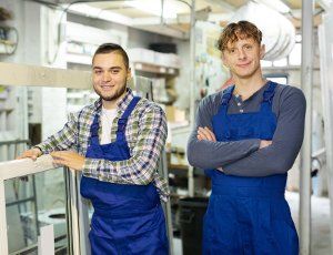 2 men wearing dungarees as work uniform