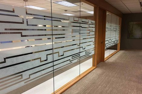 A hallway with a maze design on the glass walls. A hallway with a maze design on the glass walls.