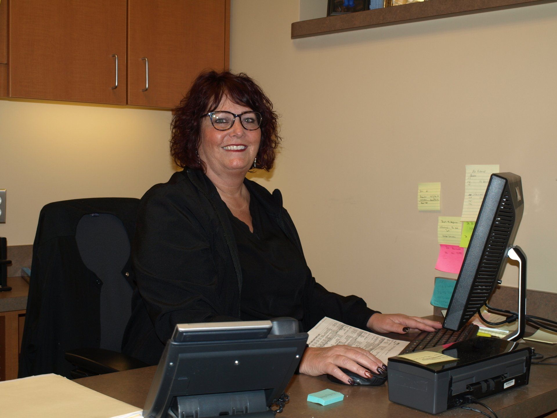 Woman with a computer in front of her — Clinton TWP, MI — Baker & Ochs Family Dentistry