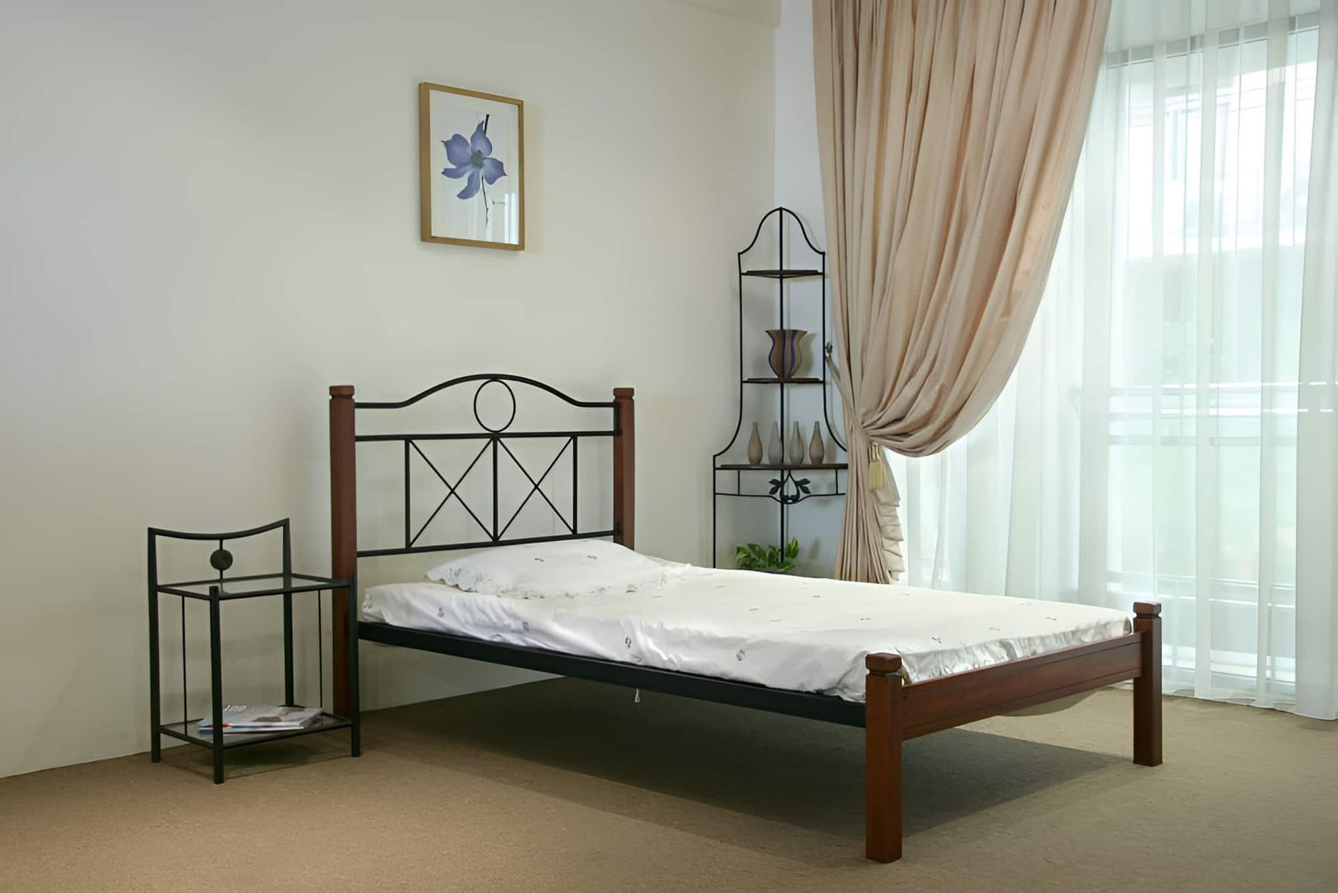A Bedroom With a Bed a Nightstand and a Picture on the Wall — Bryants Beds and Mattresses In Lismore, NSW