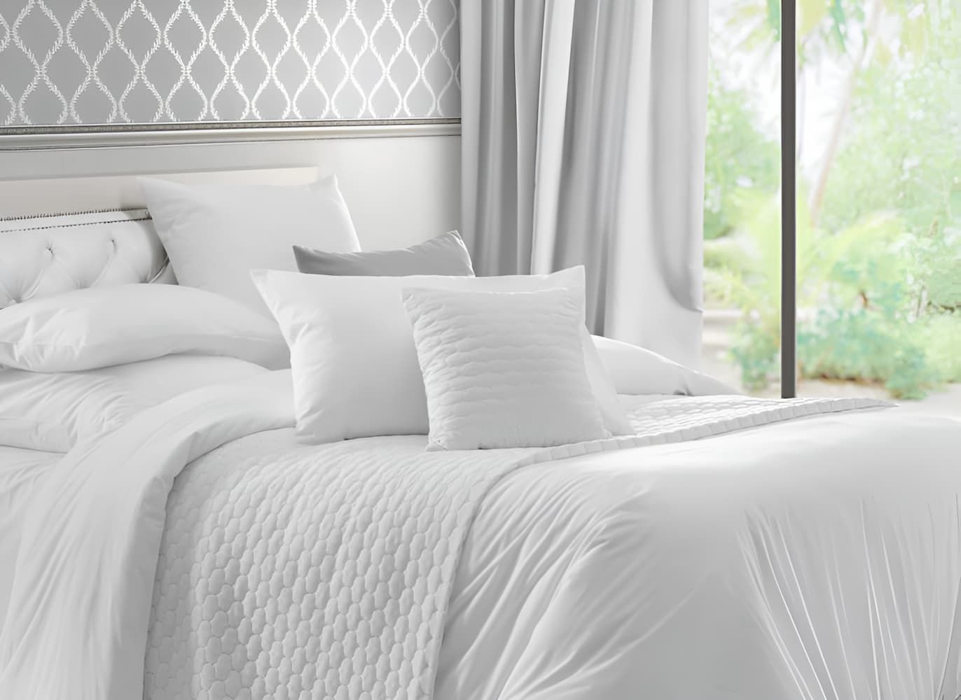 A Bed With White Sheets and Pillows in a Bedroom Next to a Window — Bryants Beds and Mattresses In Lismore, NSW
