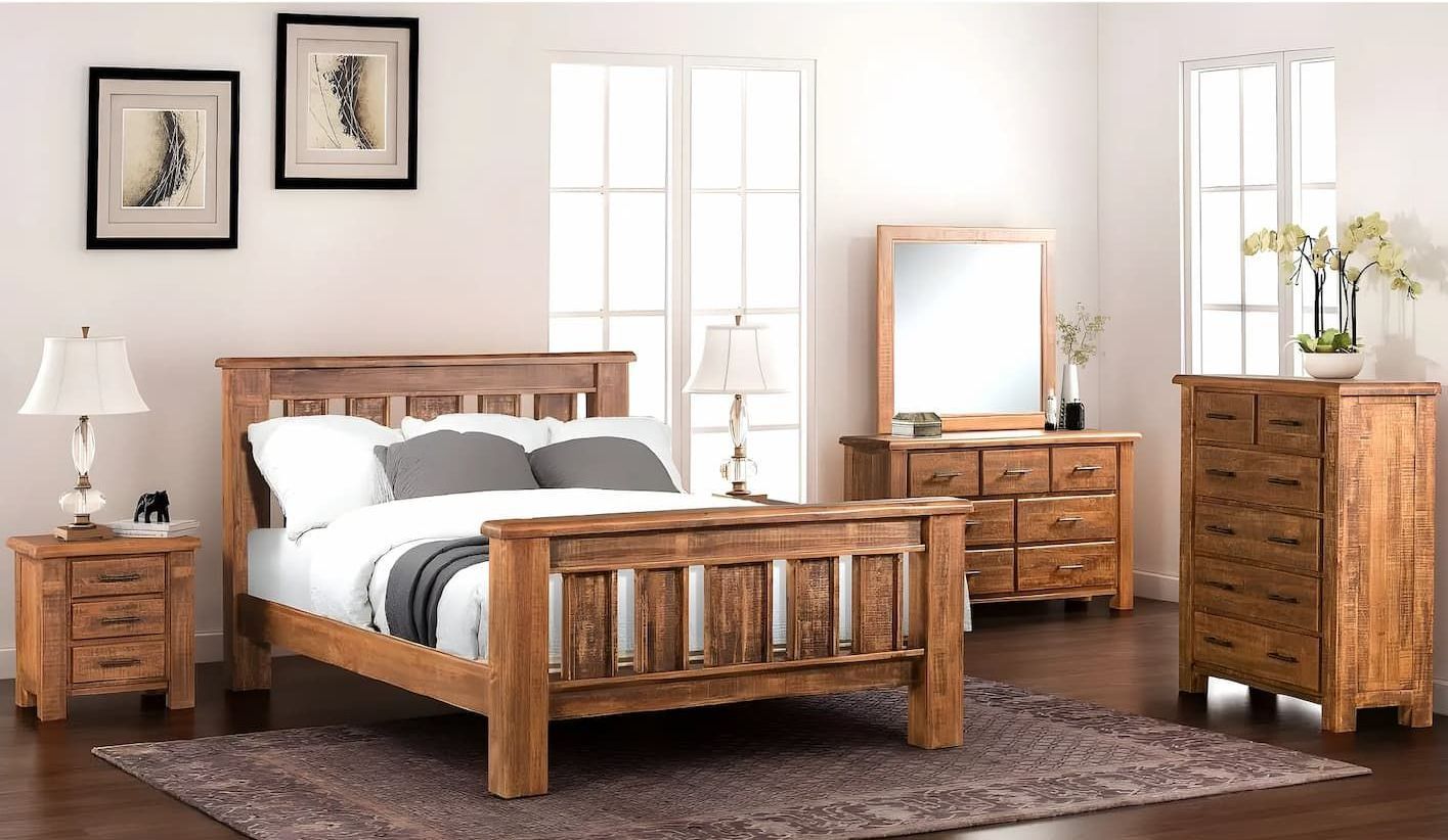 A Bedroom With a Bed Dresser Mirror and Nightstand — Bryants Beds and Mattresses In Lismore, NSW