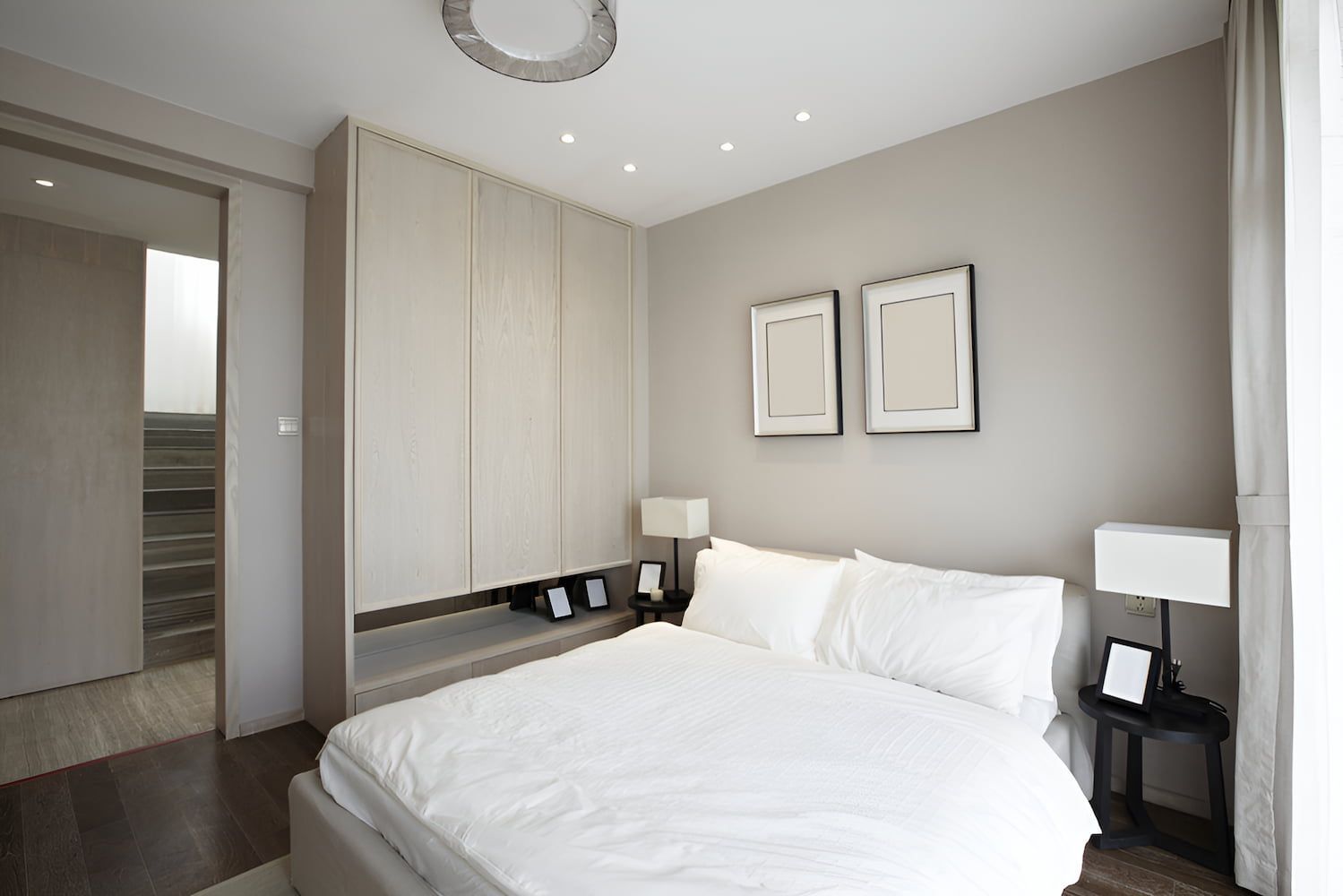 A Bedroom With a Bed and Two Pictures on the Wall — Bryants Beds and Mattresses In Lismore, NSW