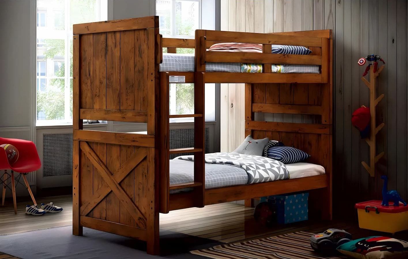 A Wooden Bunk Bed is Sitting in a Room With a Red Chair — Bryants Beds and Mattresses In Lismore, NSW