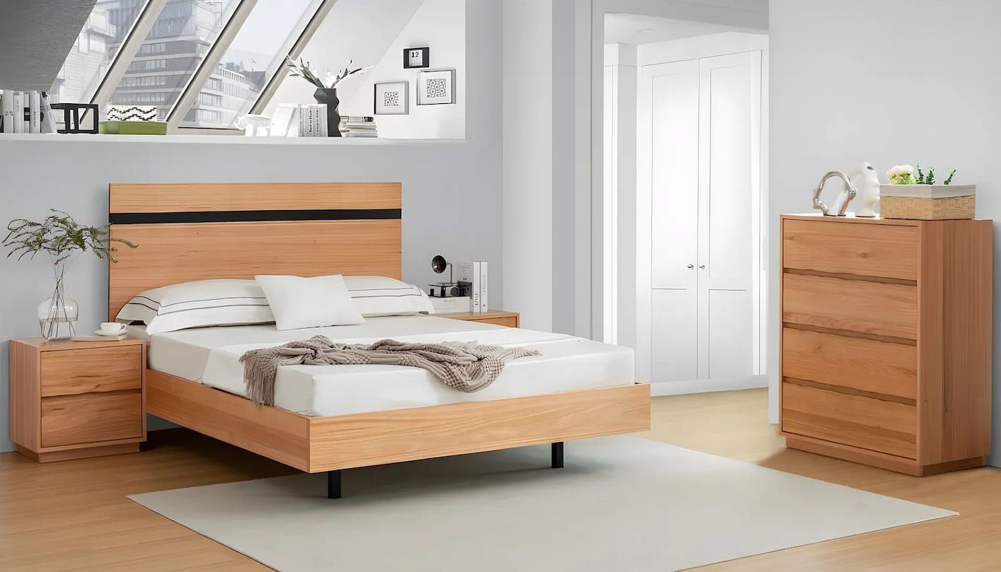 A Bedroom With a Bed, Dresser, Nightstand and a Rug — Bryants Beds and Mattresses In Lismore, NSW