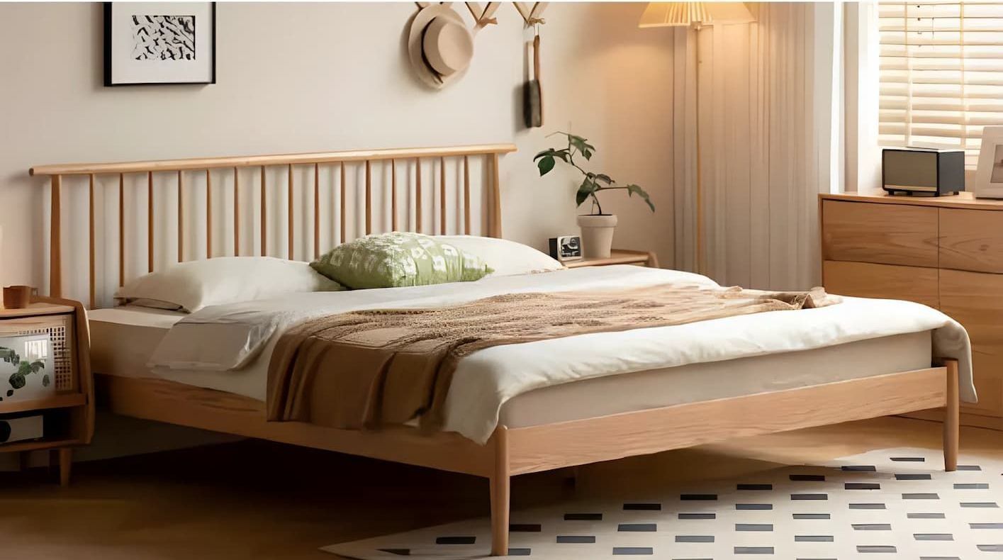 A Bedroom With a Bed, Dresser, Nightstand and Lamp — Bryants Beds and Mattresses In Lismore, NSW