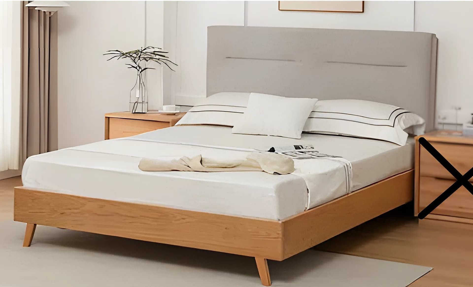 A Bed With a Wooden Frame and a Gray Headboard in a Bedroom — Bryants Beds and Mattresses In Lismore, NSW
