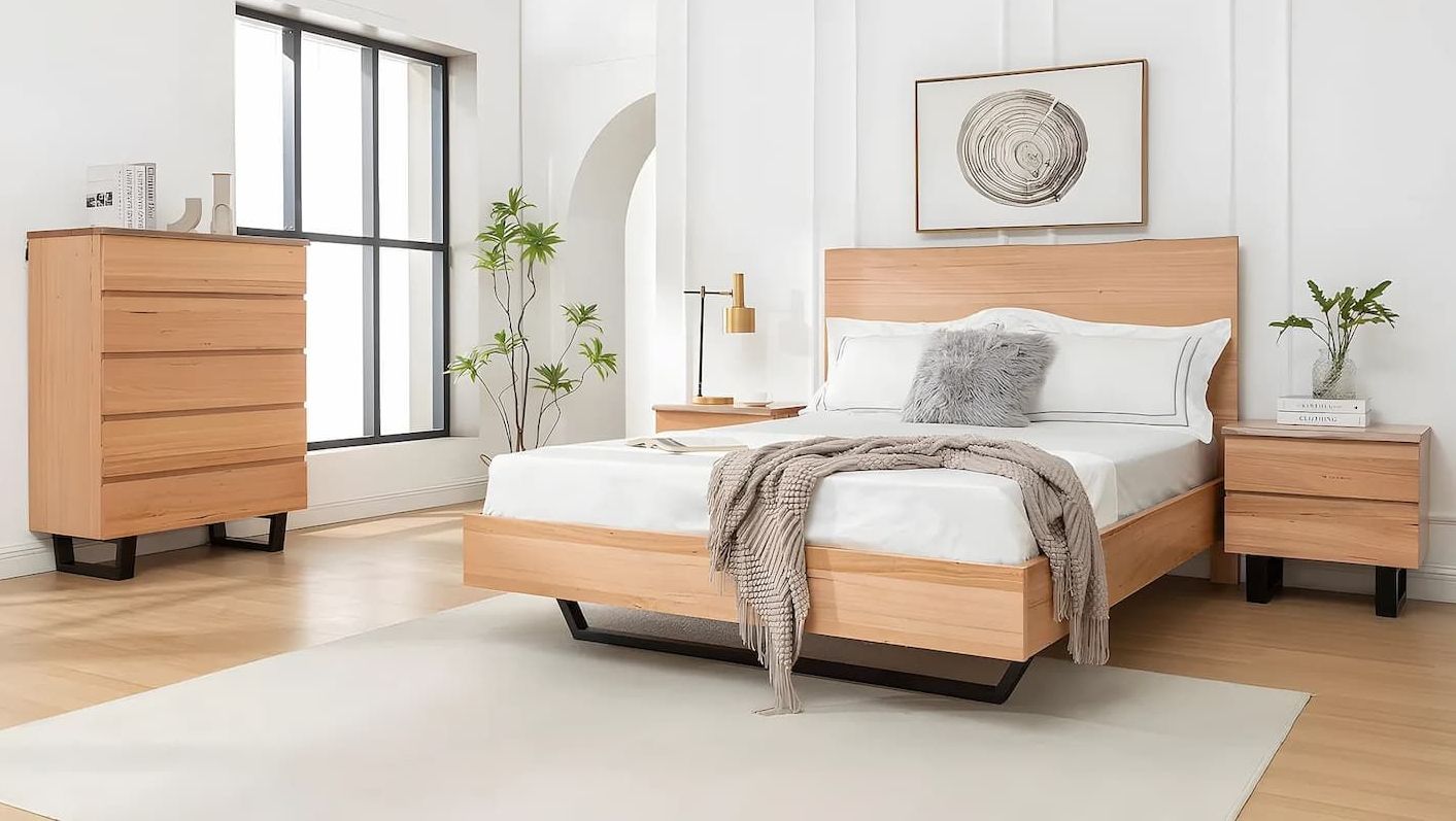A Bedroom With a Bed , Dresser and Nightstand — Bryants Beds and Mattresses In Lismore, NSW