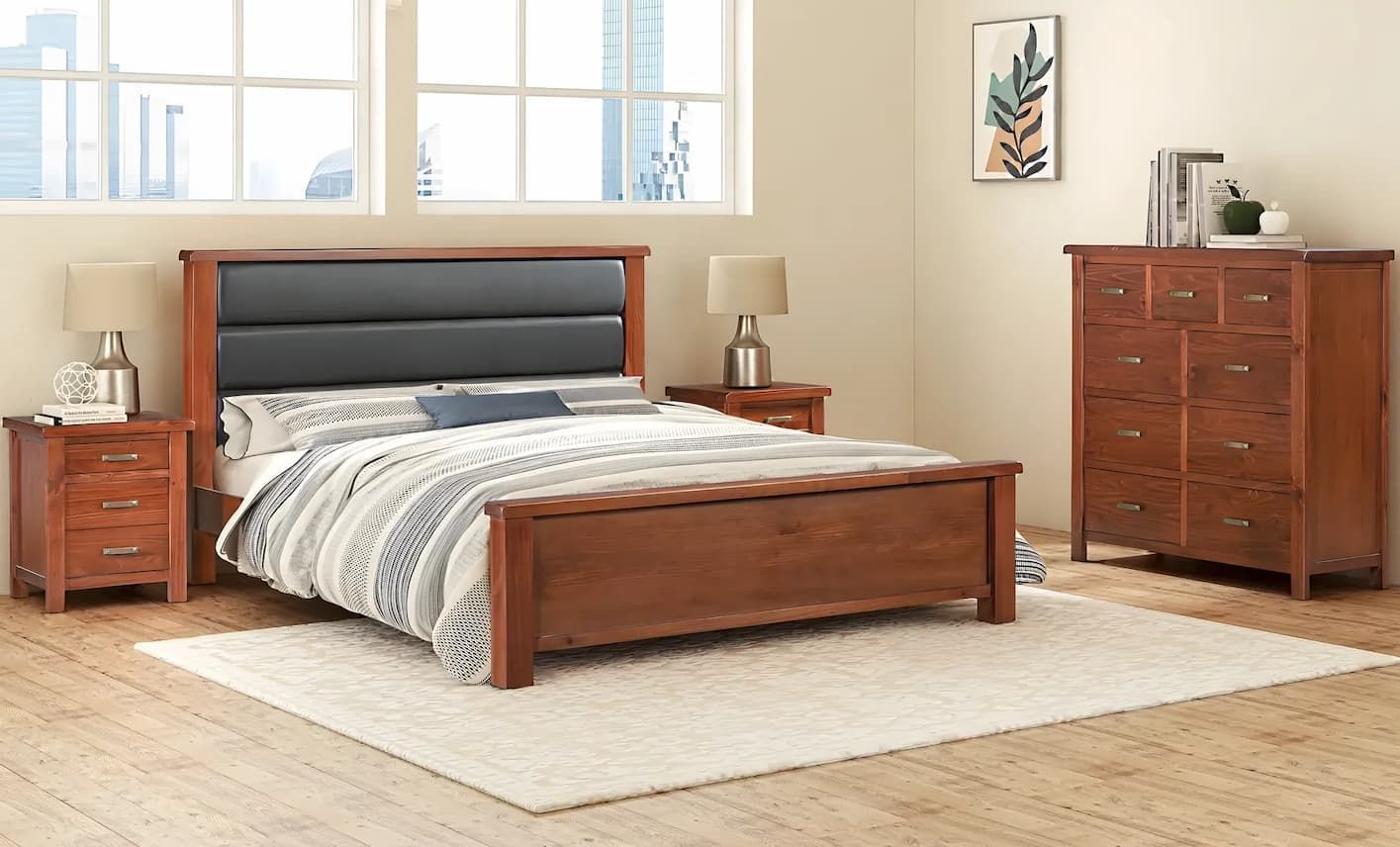 A Bedroom With a Bed , Nightstand , Dresser and Rug — Bryants Beds and Mattresses In Lismore, NSW