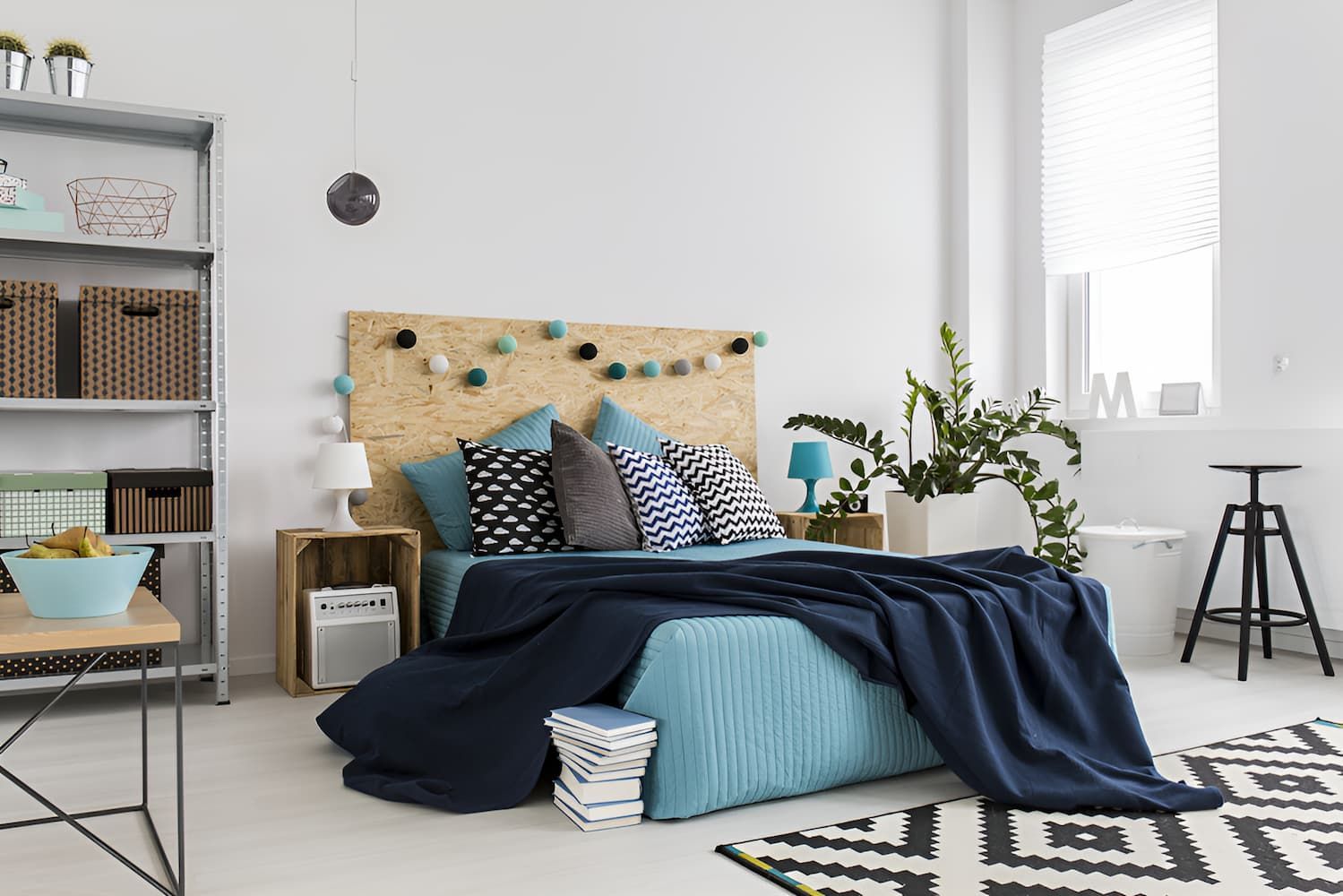 A Bedroom With a Bed, Nightstands, a Rug and a Window — Bryants Beds and Mattresses In Lismore, NSW