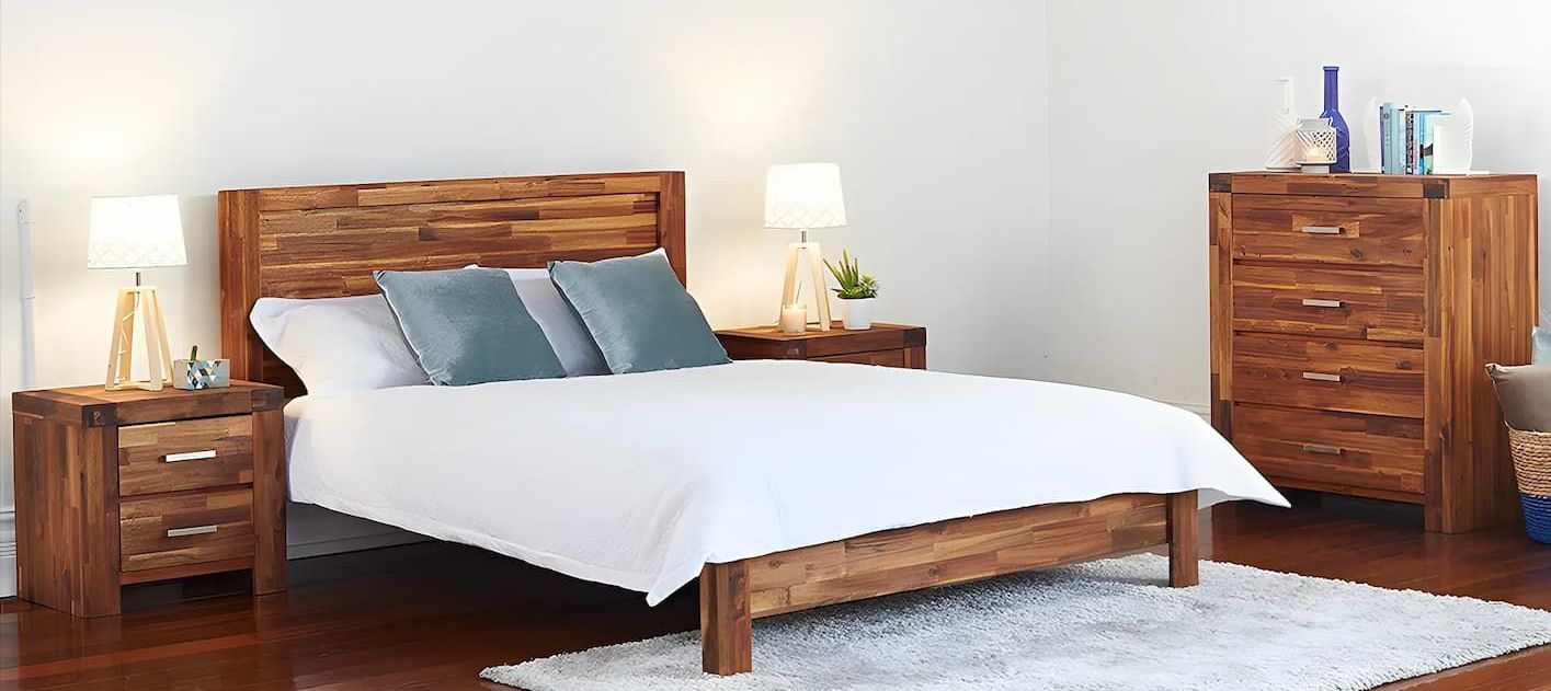 A Bedroom With a Bed, Nightstand, Dresser and Rug — Bryants Beds and Mattresses In Lismore, NSW