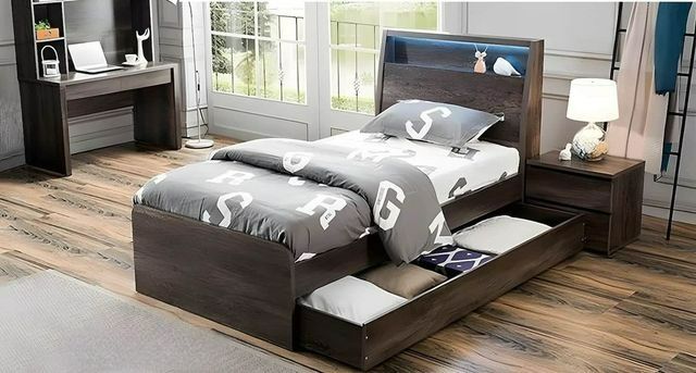 A Bedroom With a Bed, Desk and Nightstand — Bryants Beds and Mattresses In Lismore, NSW