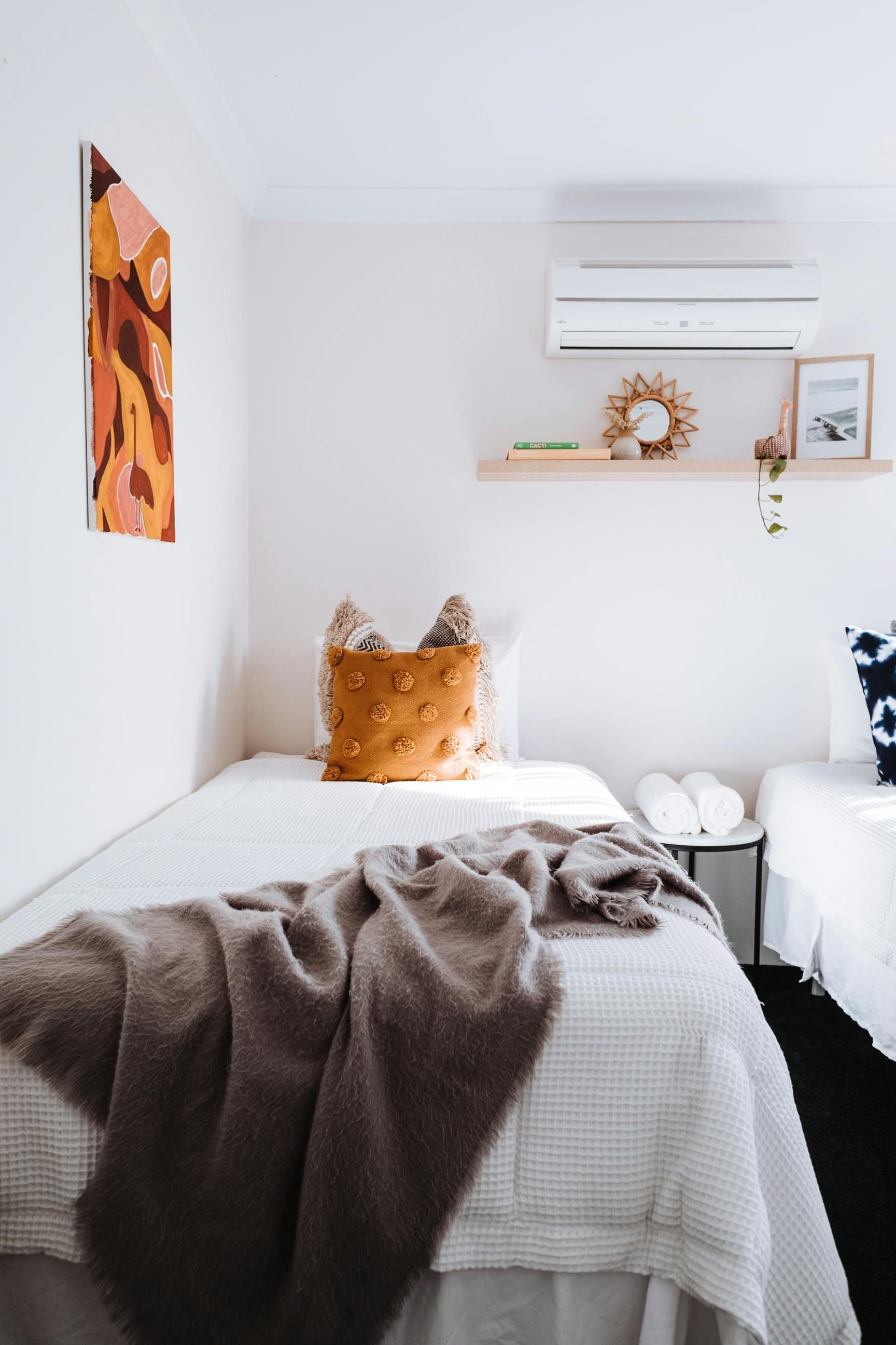 A Bedroom With a Bed, Nightstand, and Dresser — Bryants Beds and Mattresses In Lismore, NSW