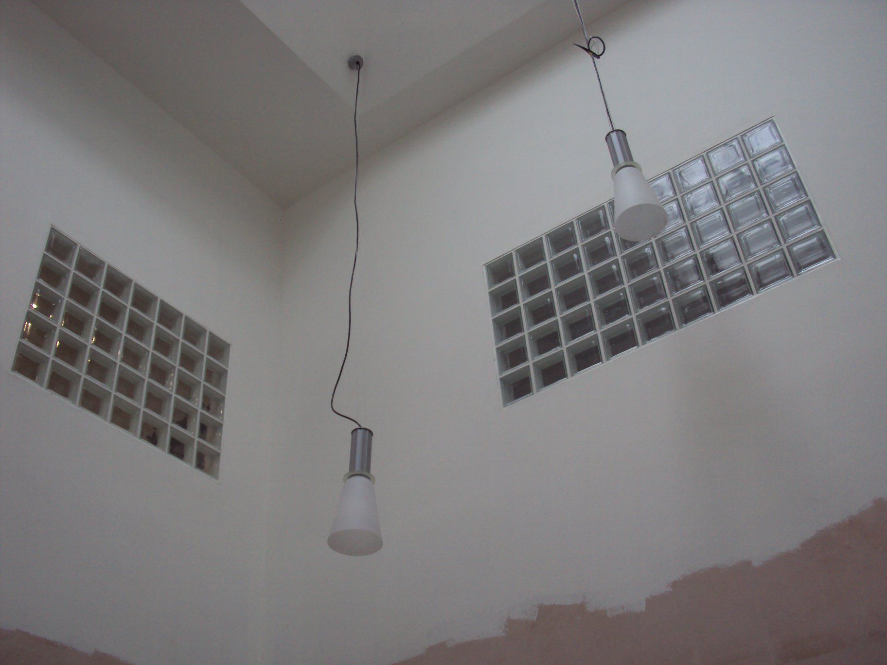 Glass block windows in a high wall to let in light