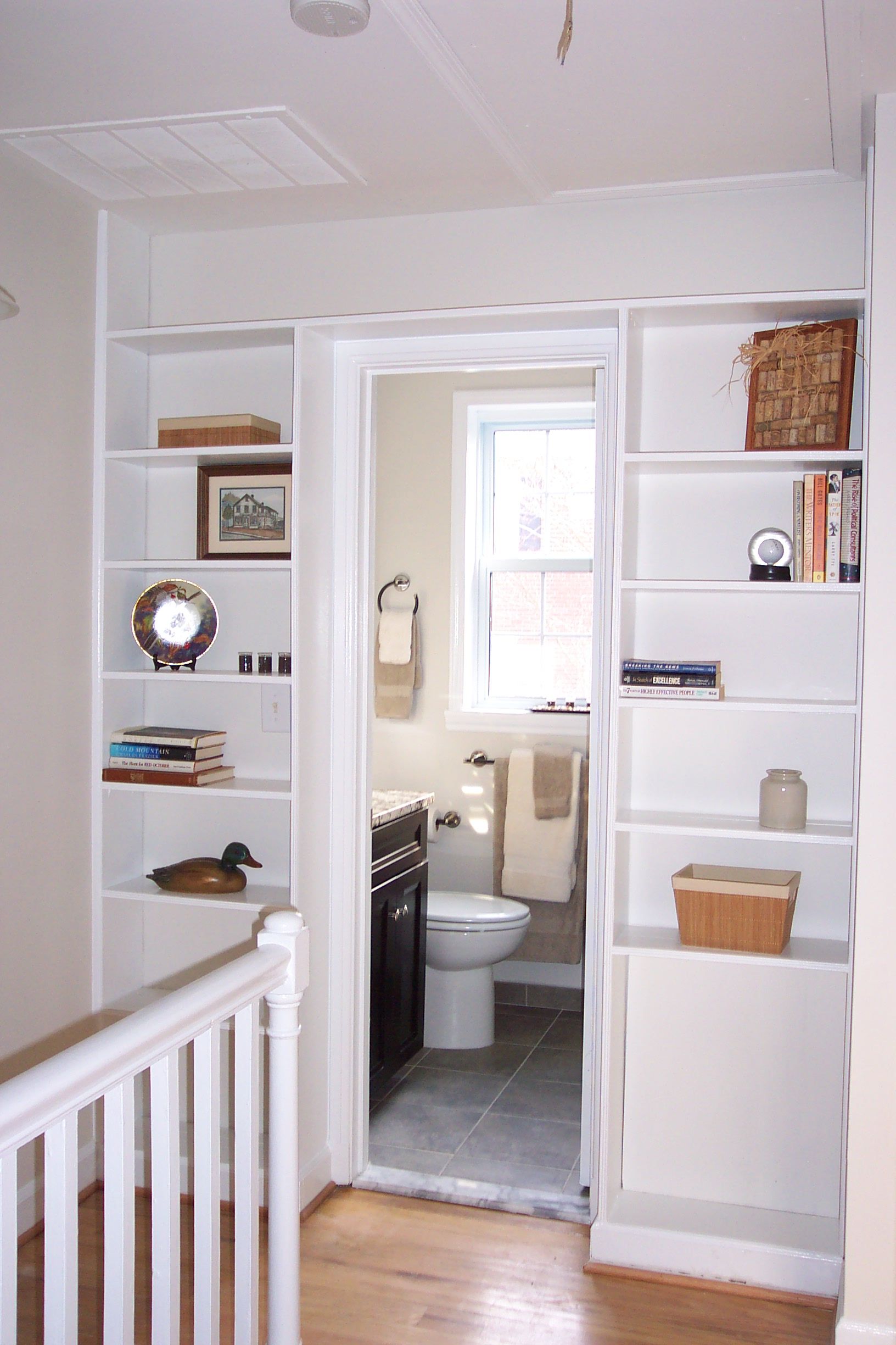A staircase leading to a bathroom with a toilet