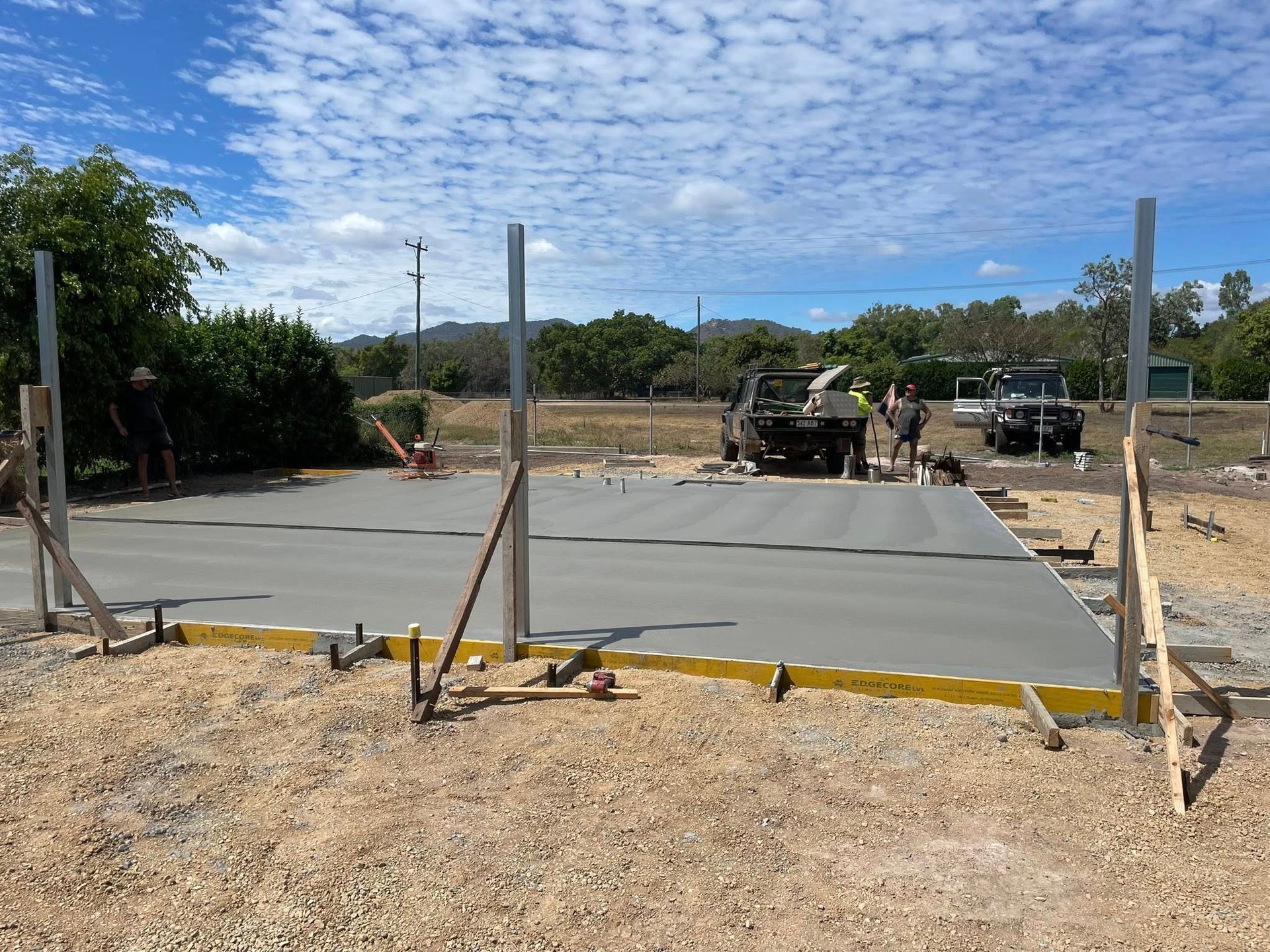 Freshly Poured Concrete Slab for a Structure, With Wooden Frames — Sun Co Concrete And Construction in Dimbulah, QLD