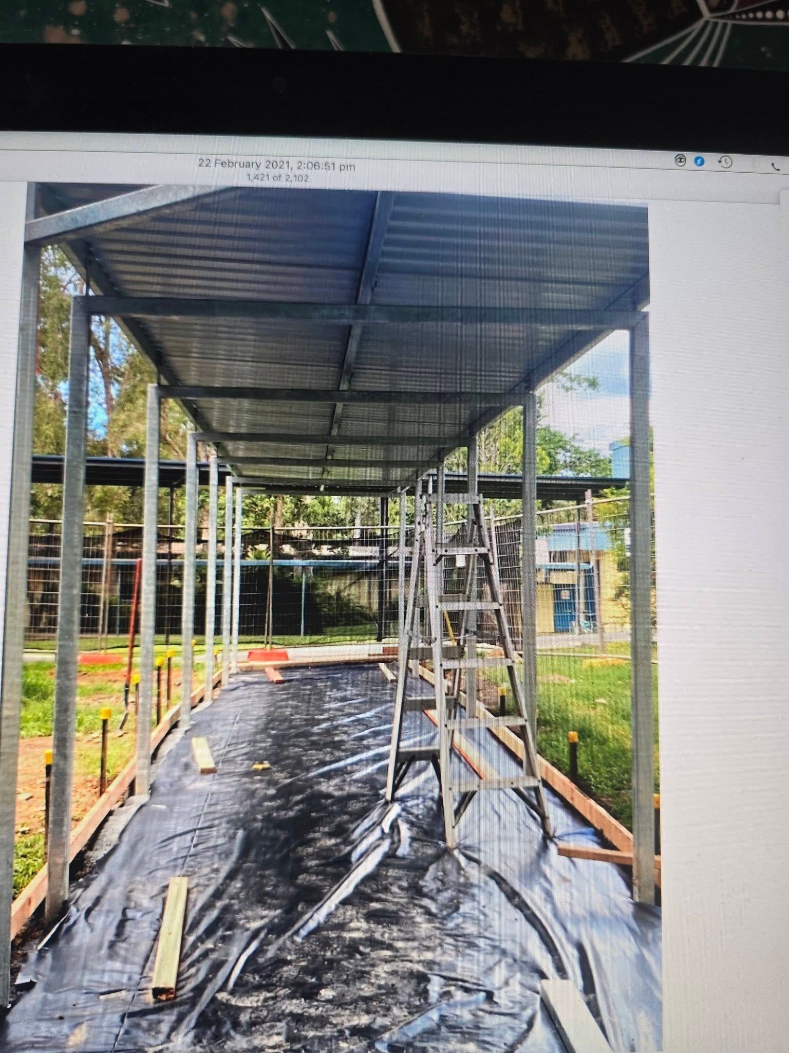 Metal Framed Walkway With Corrugated Roof Under Construction — Sun Co Concrete And Construction in Dimbulah, QLD