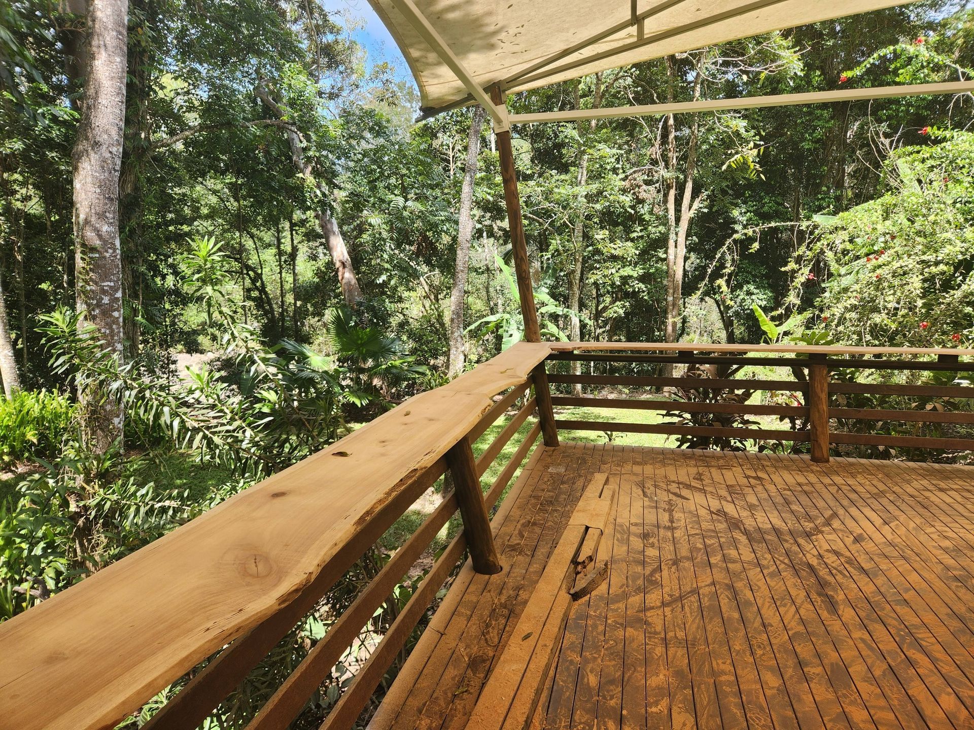 Concrete Block Retaining Wall Next to a Building on a Hillside — Sun Co Concrete And Construction in Dimbulah, QLD