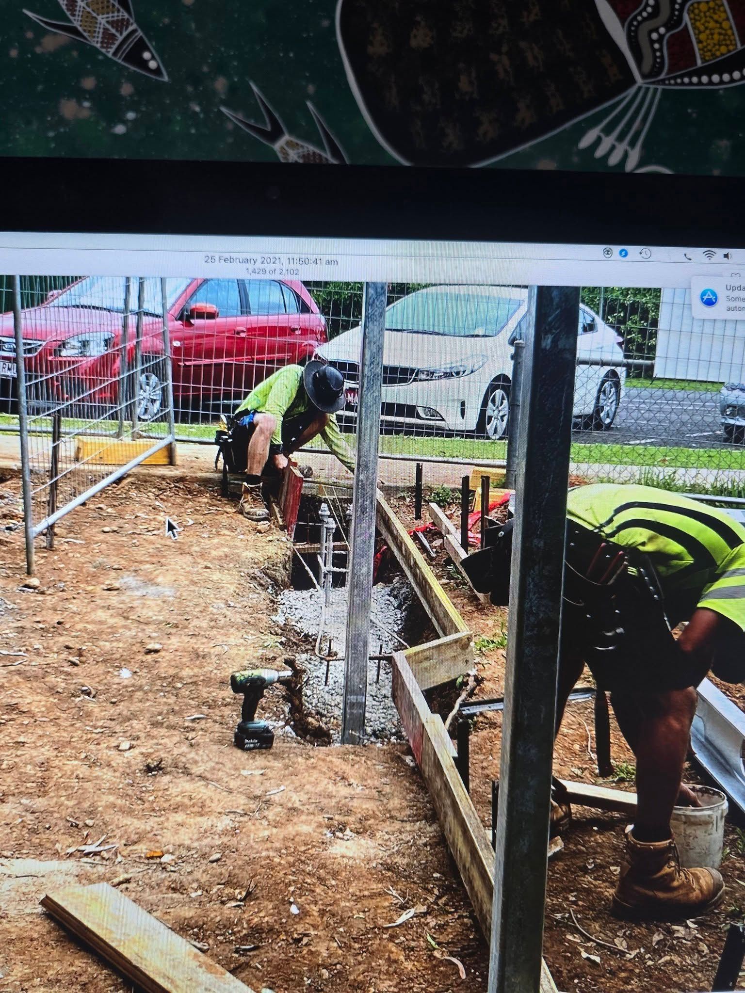 Construction Workers in Safety Vests Building a Foundation Outdoors — Sun Co Concrete And Construction in Dimbulah, QLD