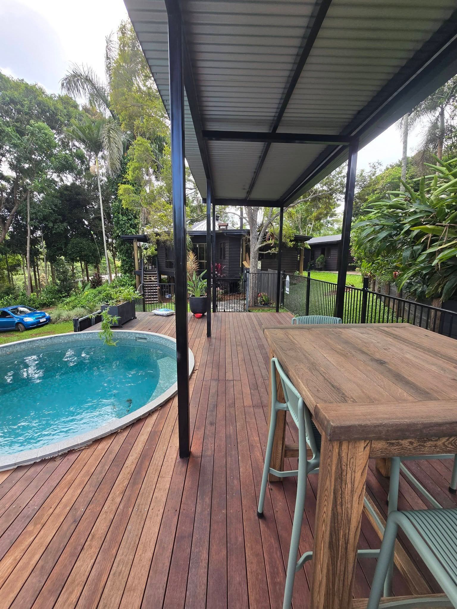Construction of a Wooden Deck Near a Circular Pool — Sun Co Concrete And Construction in Dimbulah, QLD