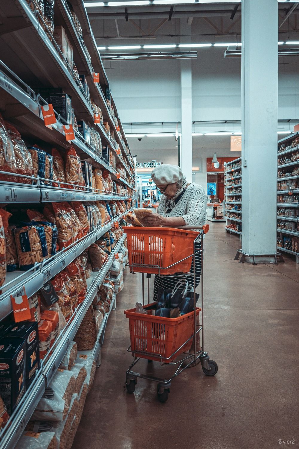 Elderly white woman grocery shopping