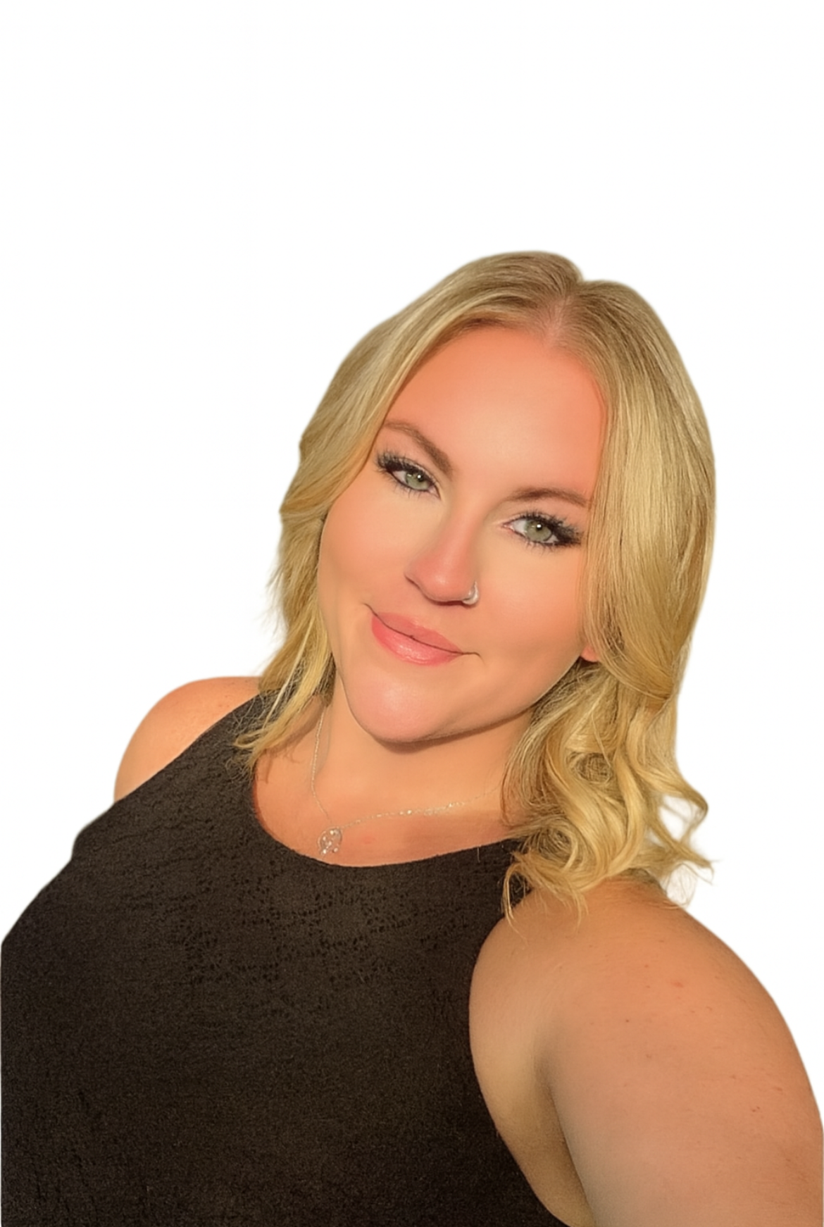 A woman with long red hair is smiling in front of a beach background