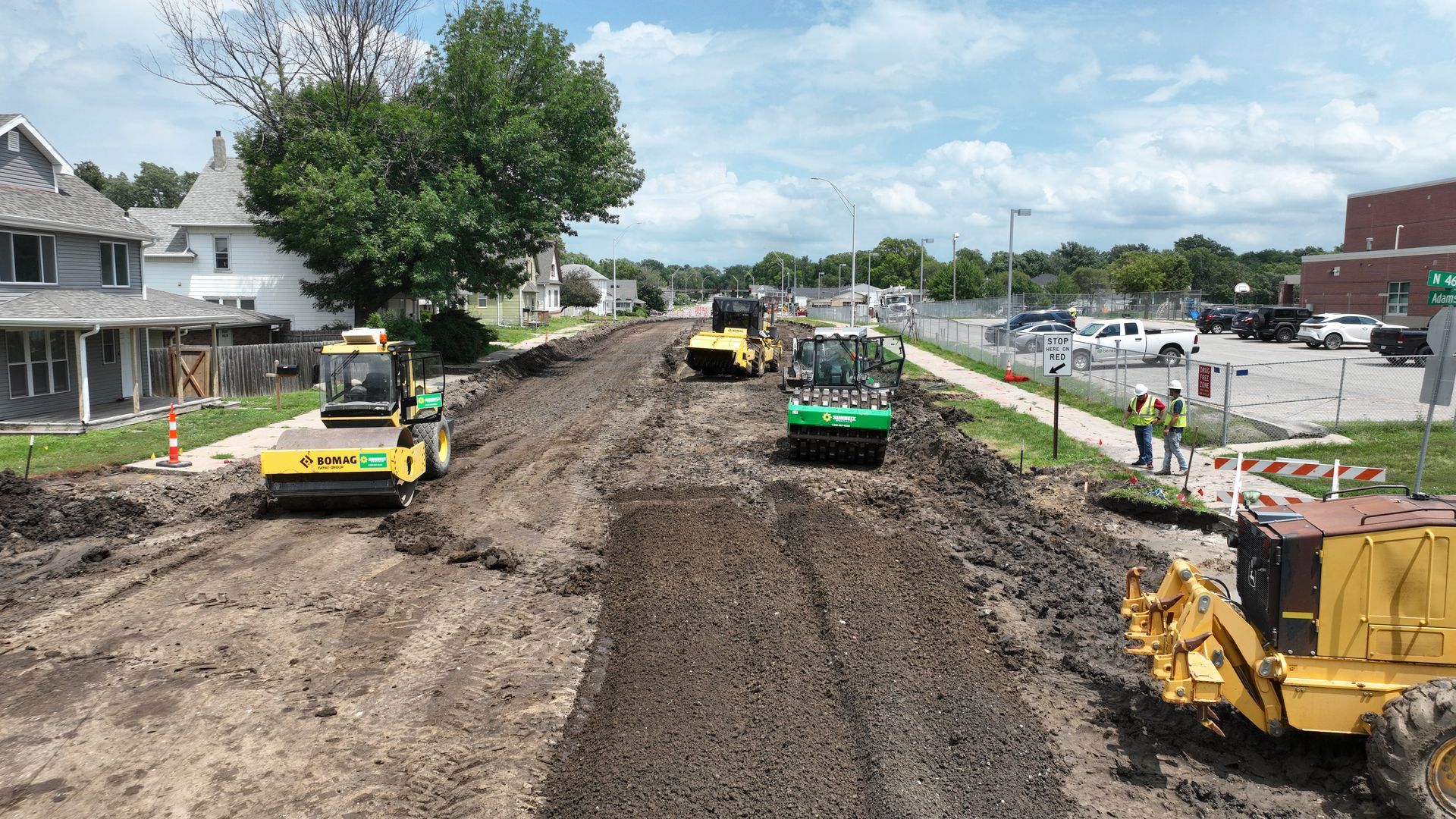 CL Construction paving crew laying fresh concrete on Adams Street in Lincoln, Nebraska, as part of the LTU street rehabilitation project, with a Gomaco Paver machine
