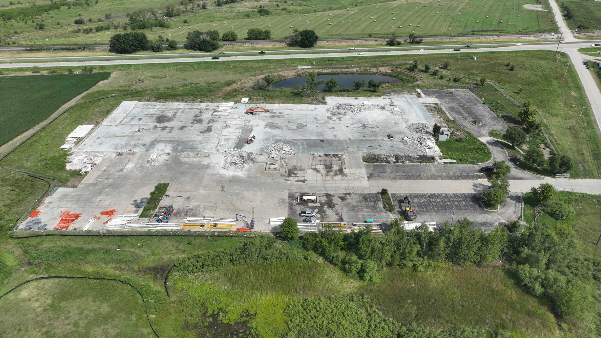 CL Construction crew using excavators to demolish and remove debris from the tornado-destroyed Garner Industries warehouse in Lincoln, Nebraska